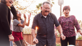 download Square image of a man dancing with family with the words Get Down With Your Blood Pressure (Entrale a bajar tu presion) in Spanish and the Hispanic Heritage Month logo